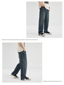 Detail view of baggy retro washed blue denim jeans showing relaxed fit and soft drape effect