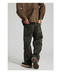 Detail view of baggy camouflage cargo pants back with pockets and utility tool loop