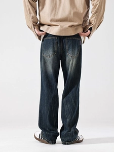 Men's slim-fit dark blue washed straight jeans with vintage fading and distressed details