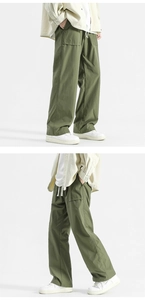 Detail of army green cargo pants with drawstring waist and large side pockets