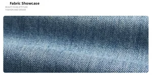 Macro shot of light blue washed denim fabric with detailed twill weave texture