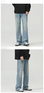 Detail showing vintage ice blue flared jeans with premium drape and washed texture