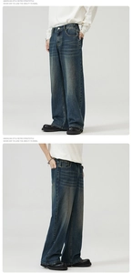 Macro detail of retro dark blue wide-leg jeans with vintage washed texture and cat whiskers