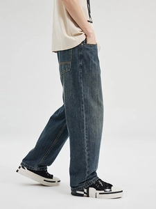 Mens high street loose wide leg jeans in distressed dark blue denim with vintage wash effect