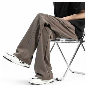 Close-up of loose wide-leg deep brown casual trousers with high-drape icy silk fabric
