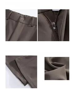 Detail view of coffee brown flared trousers featuring waist button and fine twill texture