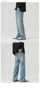 Detail view of American vintage light blue flared denim jeans with back pocket stitching