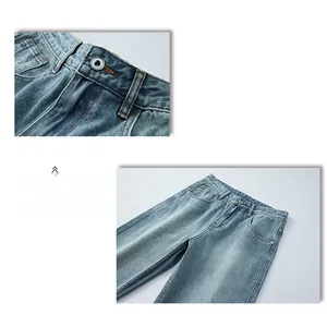Détails de la taille montrant le bouton en métal et les coutures sur jean bleu clair