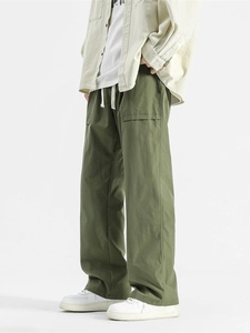 Army green wide-leg cargo pants with drawstring waist and large side flap pockets