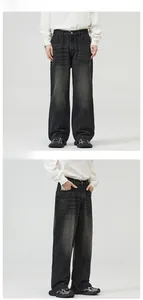 Detail view of retro washed dark grey loose straight wide leg denim jeans with whiskering
