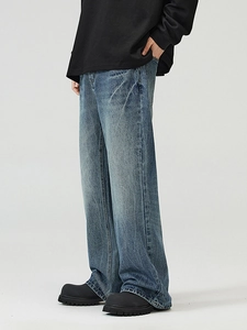 Men's vintage blue flared jeans with lightning wash and distressed retro denim style