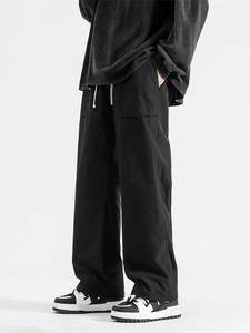 Unisex black wide-leg cargo trousers with white drawstring and large side pockets