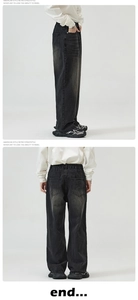 Detail of vintage washed loose straight denim pants with classic five-pocket design