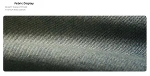 Detailed macro view of dark blue washed denim fabric with distinct twill texture
