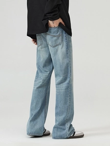 Men's light blue washed flare jeans with street style relaxed fit and back pocket detail