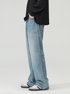Men's light blue washed flare jeans with vintage distressed finish and wide leg cut
