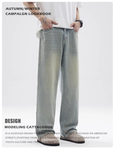 Detail of light blue vintage washed jeans with retro cat whiskers and distressed textures