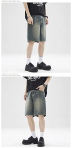 Detail showing vintage wash denim shorts with relaxed fit and American retro street style