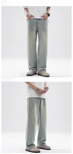Front and side view of men's vintage light wash straight leg baggy jeans on model