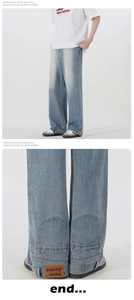 Close-up of inverted brown leather patch and denim texture on wide-leg jeans