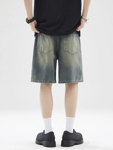 Men's retro washed denim shorts in wide-leg fit with vintage distressed finish