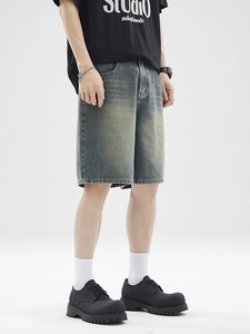 Men's retro washed denim shorts in loose fit style with distressed blue vintage finish
