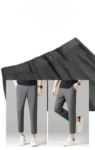 Detail view of men's slim fit dark grey business pants with high-quality waist stitching