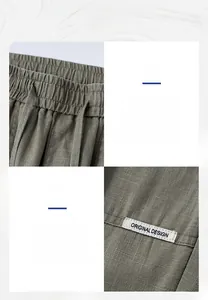 Detail view of cotton linen trousers featuring elastic drawstring waist and side woven labels