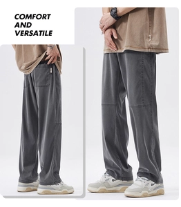 Detail view of men's thick grey loose straight casual pants with split seam design