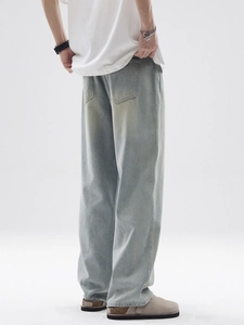 Men's retro light wash loose straight denim jeans with vintage faded texture details