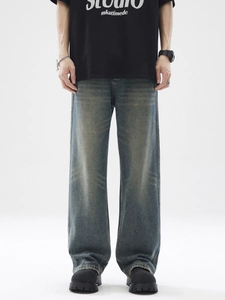 Jean ample rétro à jambes larges avec délavage vintage et moustaches en denim bleu foncé