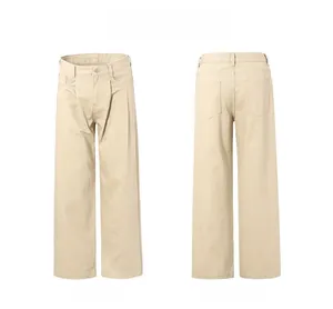 Detail view showing front and back of beige loose fit cotton twill trousers with pleats