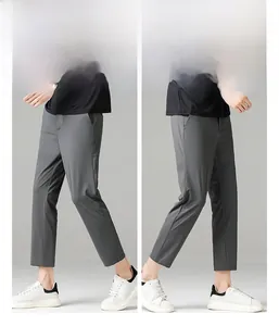 Macro detail of men's slim fit grey business trousers with elastic ice silk fabric