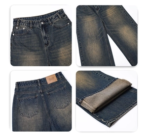 Detailansicht der Vintage-Jeans mit Metallknopf, Taillenaufnäher und Dirty-Wash-Denim