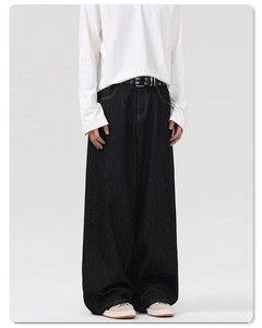 Macro view of black loose fit straight denim jeans with premium metal eyelet belt detail