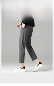 Detailed view of gray stretch slim fit trousers featuring breathable ice silk fabric