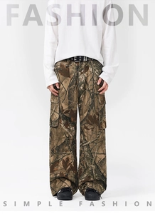 Detailed close-up of woodland branch camo cargo pants with side utility pockets