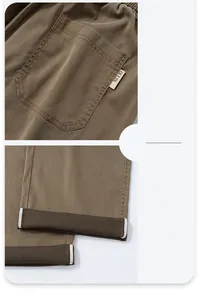 Detailed view of the khaki lounge pants showing back pocket label and cuffed leg hems