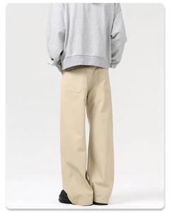 Rear view of khaki wide-leg trousers in heavy cotton twill with straight-cut silhouette