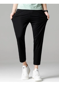Detail shot showing the high elasticity and stretch of these men's slim fit black trousers