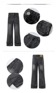 Close-up detail of dark gray washed denim with lightning patterns and metal hardware