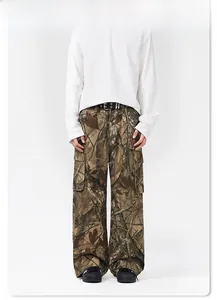 Detail view of branch camo cargo pants with side pockets and black double-hole belt