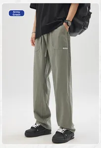 Army green men's linen casual pants with drawstring waist and original design label detail