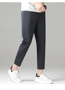 Detail view of slim fit cropped business trousers in dark grey stretch fabric