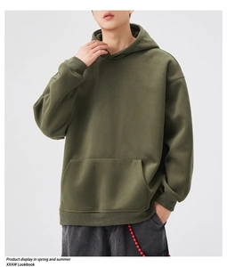 Detailed view of heavy olive green hoodie with kangaroo pocket and ribbed cuffs