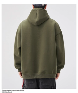 Detailed back view of heavy cotton dark green hoodie showing drop shoulder and ribbed hem