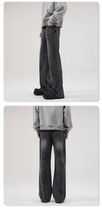Detailed view of washed denim fabric with vintage cat whiskers on flared wide-leg jeans