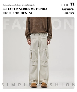Detail view of cream white cargo pants with multiple pockets and relaxed straight fit