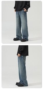 Detail view of American vintage flare jeans with heavy wash and distressed texture