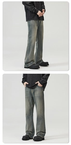 Detail of vintage blue washed denim jeans with textured fabric and flared leg fit